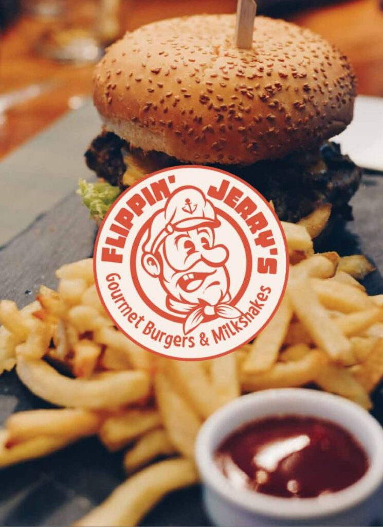 Flippin Jerrys Badge with Burger Bkg 800 x 1100 px